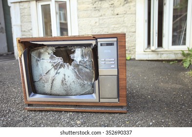 An Old Broken TV Left On The Street.