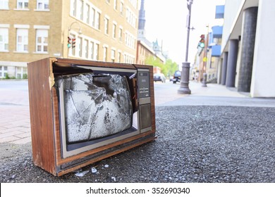 An Old Broken TV Left On The Street.