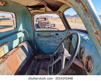 An Old Broken Vintage Car Dumped In A Desert