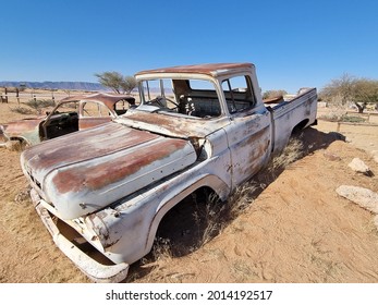 An Old Broken Vintage Car Thrown In A Desert