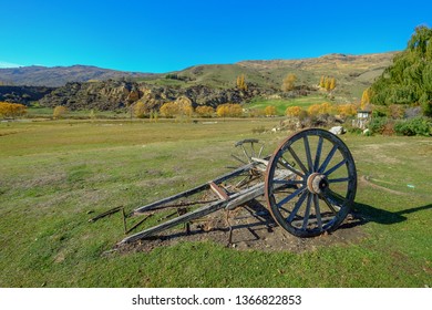 Old Broken Wagon Wheel In The Field