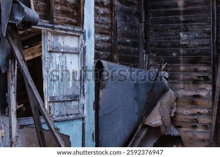 An old, Broken Window Frame on dilapidated wooden wall of an abandoned shack house at Paragkes Beach, Vouliagmeni, Athens
