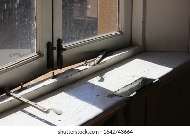 Old Broken Window Seal With Shadows And Stone Focus.