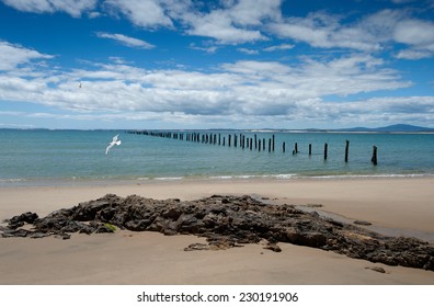 old broken wooden jetty on blue sky day - Shutterstock ID 230191906