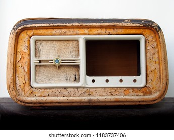 An Old Broken Wooden Vintage Radio Receiver With A Cracked Brown Case And Missing Parts