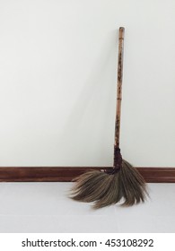 An Old Broom Against The Wall