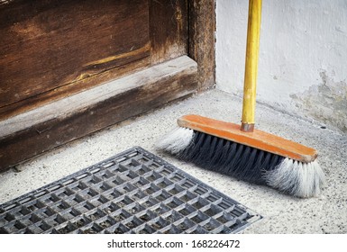 Old Broom At A Door