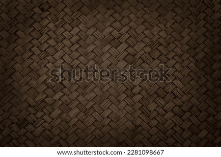 Old brown bamboo weave texture background, pattern of woven rattan mat in vintage style.