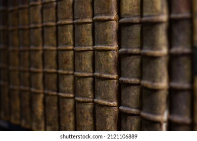 Old Brown Book Collection Leather Covers. 
Collection Of Old Books On A Shelf Background. Antique Bookstore