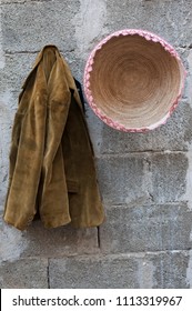 Old Brown Coat Hanging On The Wall