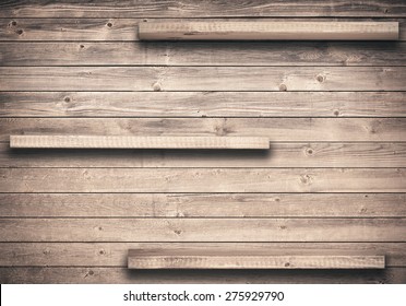 Old Brown Empty Shelf On Wooden Wall