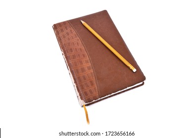 Old Brown Leather Diary On A White Background