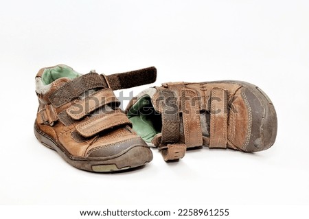 Old brown leather shoes, on a white background