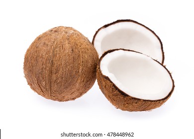 Old brown organic coconut fruit copra broken into pieces and stacked on white background