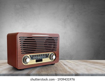Old brown radio, retro radio on wooden table. Perspective vintage radio.