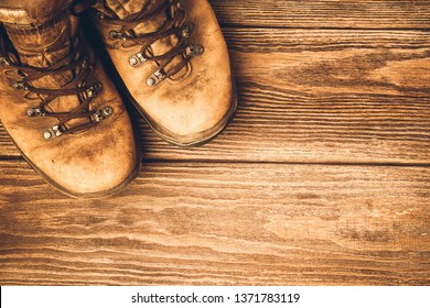 Old brown worn boots close-up. Selective focus. Concept of travel and adventure. - Shutterstock ID 1371783119