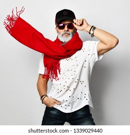 Old brutal senior rich man in white designer t-shirt cap and long red scarf stylish fashionable men isolated on white background