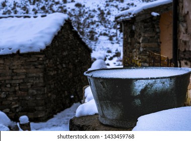old bucket covered with ice during a dark winter day with snow - Image