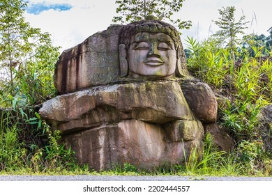 The Old Buddha Carved On Big Boulder In Laos.