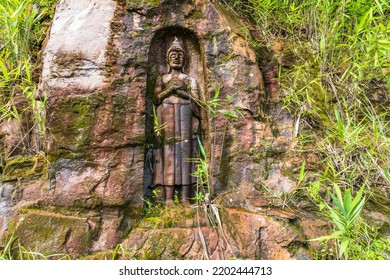 The Old Buddha Carved On Big Boulder In Laos.