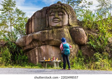 The Old Buddha Carved On Big Boulder In Laos.