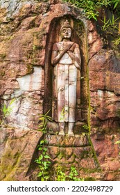 The Old Buddha Carved On Big Boulder In Laos.