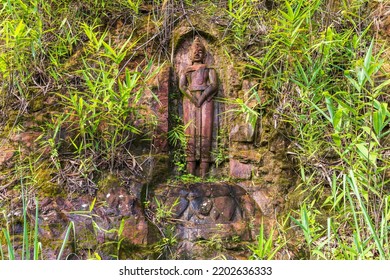 The Old Buddha Carved On Big Boulder In Laos.