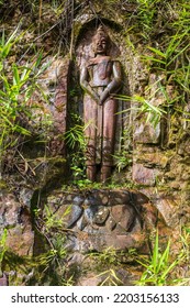 The Old Buddha Carved On Big Boulder In Laos.