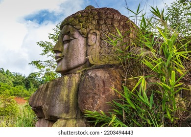 The Old Buddha Carved On Big Boulder In Laos.