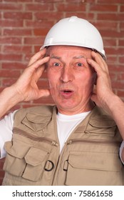 old builder in the helmet