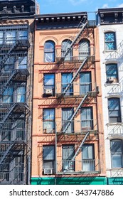 Old Building In Downtown Manhattan, NYC, With Typical Fire Escape Stairs 