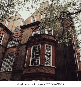 Old Building In London UK With Front Porch Window Sticking Out From The Side Of The House. 