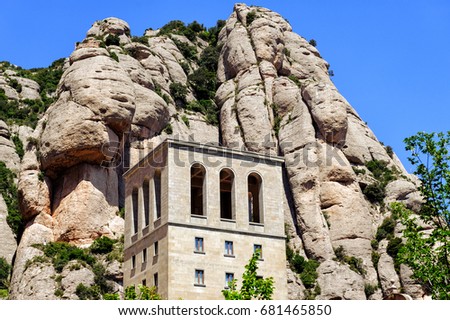 Old building of Montserrat monastery located between huge rocks in Catalonia, Spain