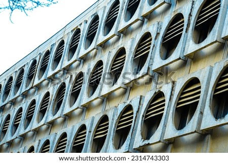 old building wall eterior with round windows