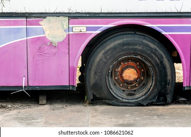 Old Bus Flat Tire On Road.