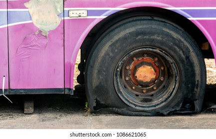 Old Bus Flat Tire On Road.