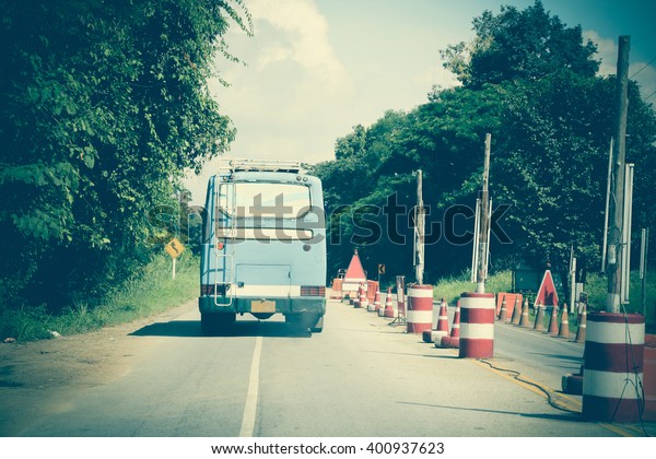 old bus running on
road