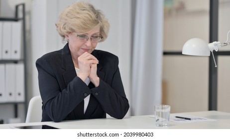 Old Businesswoman Thinking and Feeling Worried  - Shutterstock ID 2039980403