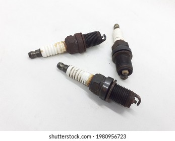 Old Busted Rusty Car Engine Plug In White Isolated Background