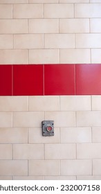Old button on tile wall