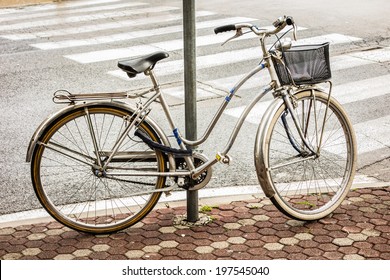 An Old Bycicle In A Tranquil Italian City