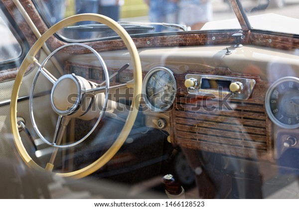 Old cabin, console and\
steering wheel in a vintage retro car. Retro toning vintage style\
image.
