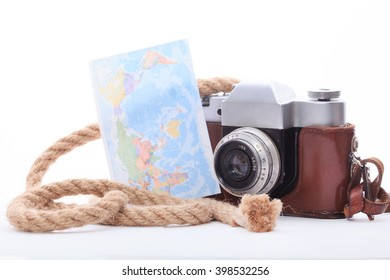 Old camera and map isolated on white background