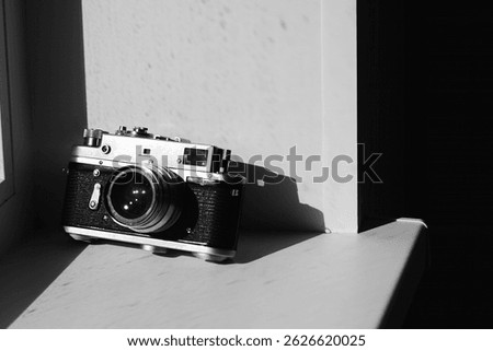 An old camera on the window