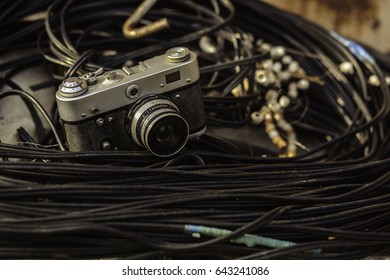 Old camera on wires/background