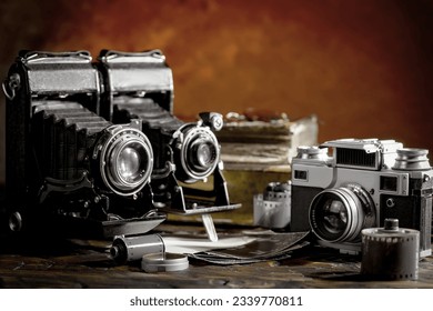 Old camera in the studio on an old background