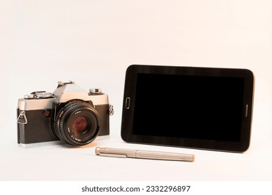 Old camera, tablet and pen