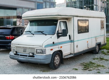 Old Camper Van Standing On Parking Lot.