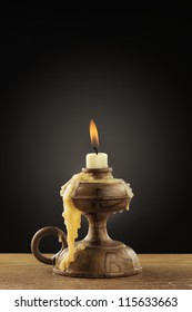 Old Candle On Dark Background