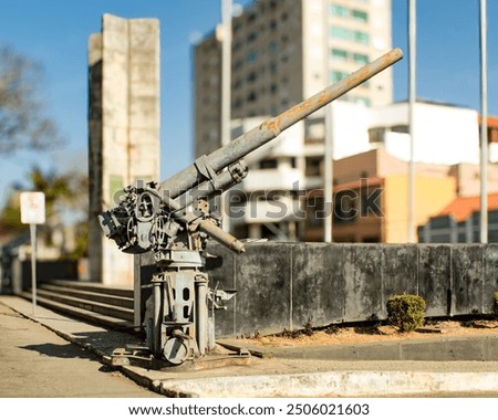 Old cannon from the Second World War in the expeditionary square in the center of the city of São João del Rei MG, Brazil, with blurred background